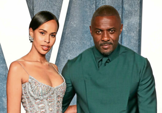 Idris Elba at Vanity Fair party with wife Sabrina.