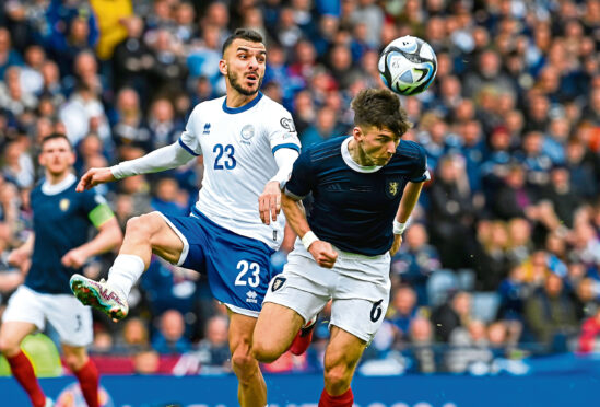 Kieran Tierney heads clear against Cyprus yesterday