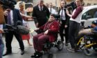 Nicholas Rossi arrives at court in Edinburgh in July last year in a wheelchair for his extradition case