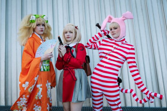 Becostumed fans pay homage to their comic book icons at the annual Comic Con at Glasgow’s SEC yesterday. They include, from left, Sam Stevenson, 16, dressed as Hiyoko Saionji; Sam Jarvis, 17, dressed as Chisato Nishikigi, and Lils Hunter, 18, as Popee the Performer