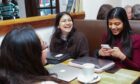 Disha Mehta, left, chats with Sonia Raheja, right, in Coffee Angel in Edinburgh