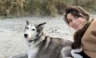 Cal Flynn and her dog, Suka, on the Isle of Eigg