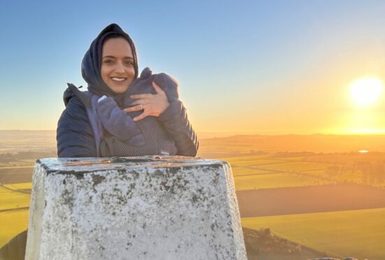 Zahrah Mahmood on North Berwick Law with son Harris