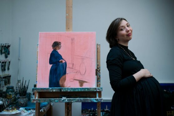 Mollie Hinshelwood with her portrait by Lesley Banks in the artist’s studio in Glasgow