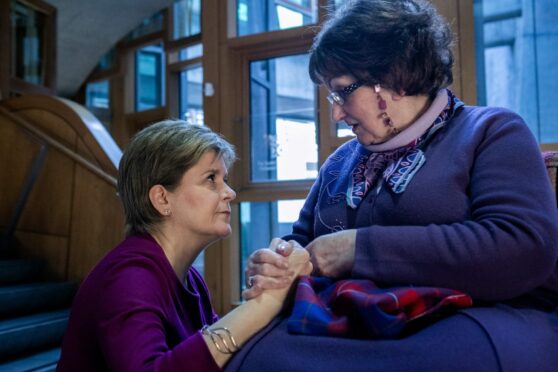 Nicola Sturgeon meeting campaigner Marion McMillan, after making an apology statement on behalf of the Scottish Government