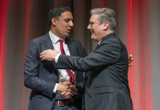 Anas Sarwar and Sir Keir Starmer shake at the Scottish Labour Party Conference