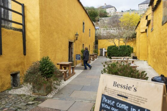 The vivid yellow outside seating area at Bessie’s