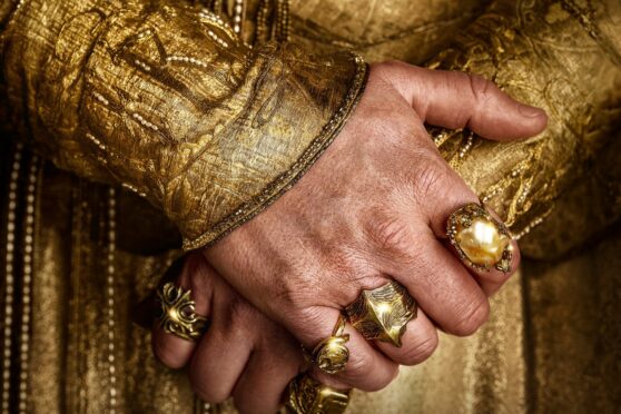 The hands of Benjamin Walker as Tolkien’s High King Gil-galad in poster for Prime series The Rings Of Power