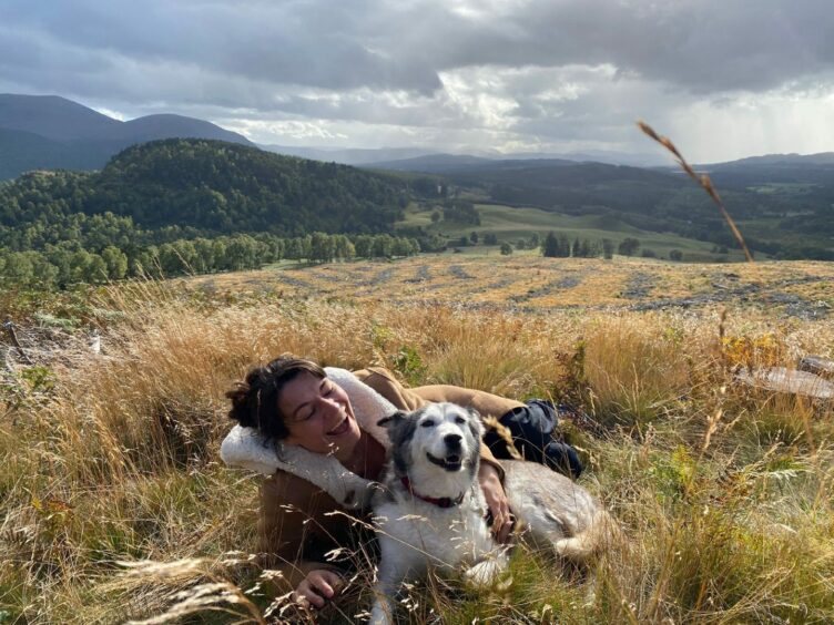 Author Cal Flynn and her dog, Suka, near Aviemore