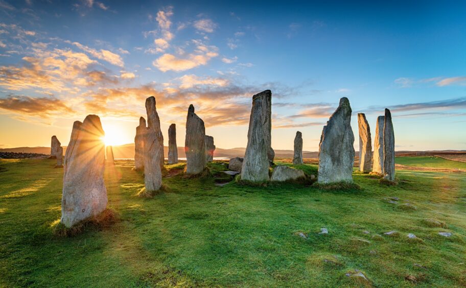 A photo of the Callanish Stones in the Outer Hebrides. Article about touring in the outer hebrides.