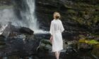 ARRAN Sense of Scotland model in front of waterfall