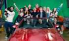 Songwriter Michael Cassidy, in driver’s seat, with film-maker Conor Reilly holding drumsticks and brother Tommy to his left, with friends at Eurovision video shoot