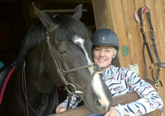 Marion MacLennan with her horse Lenny at home in Croy, Inverness