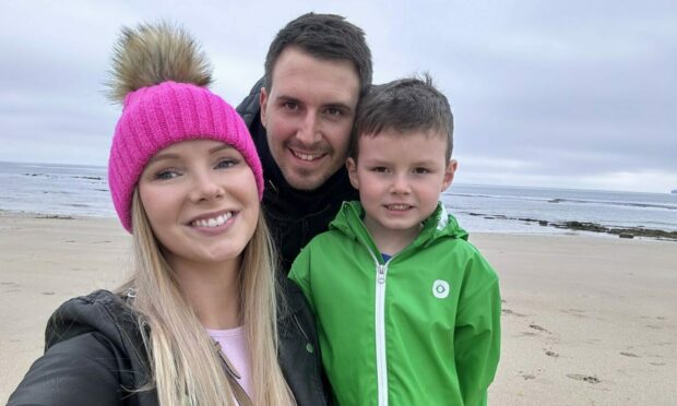 Becky with her husband and son. Image: Becky Oman