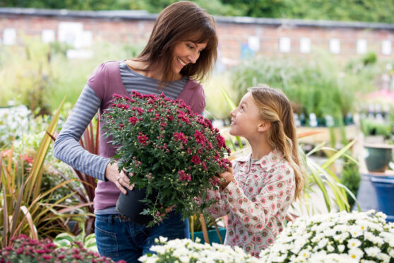 A mother and daughter in the garden