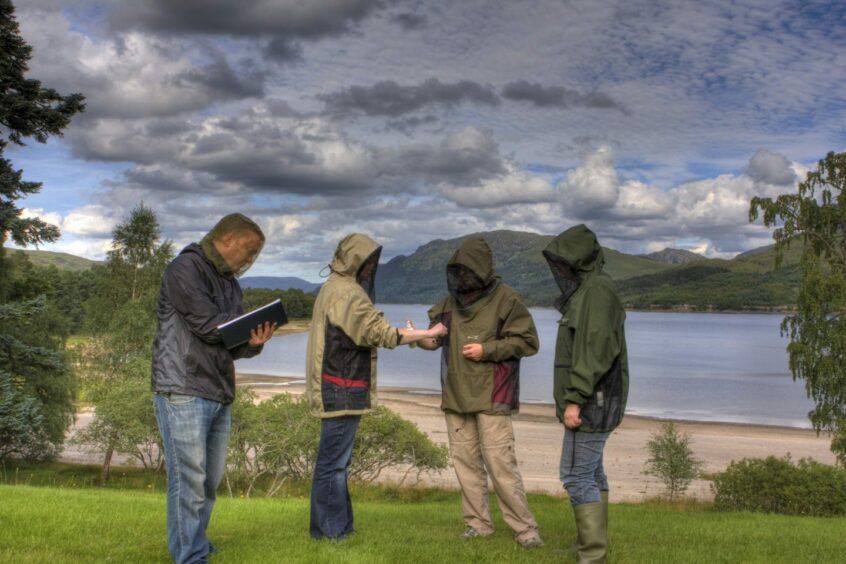a team of four people test Smidge, a midge repellent, outdoors in Scotland