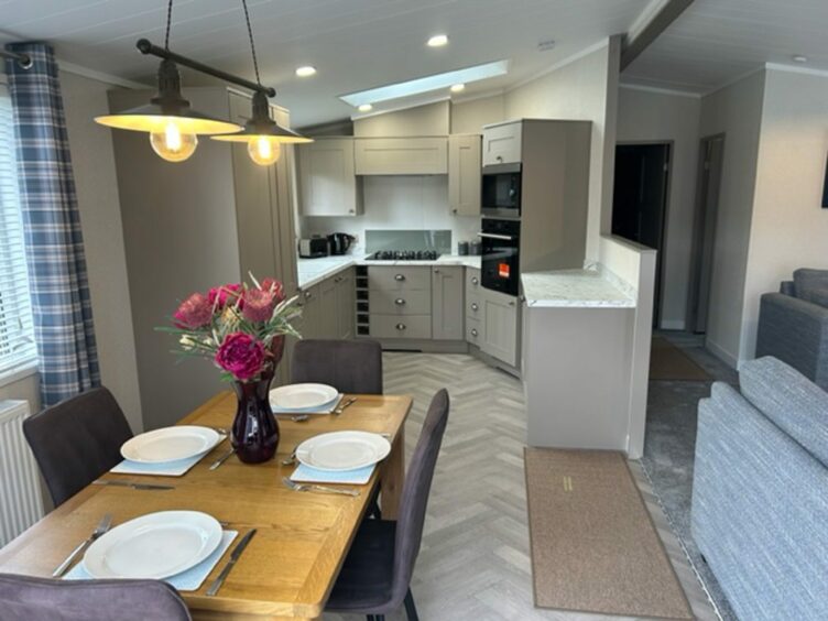 Kitchen and dining space in a holiday lodge