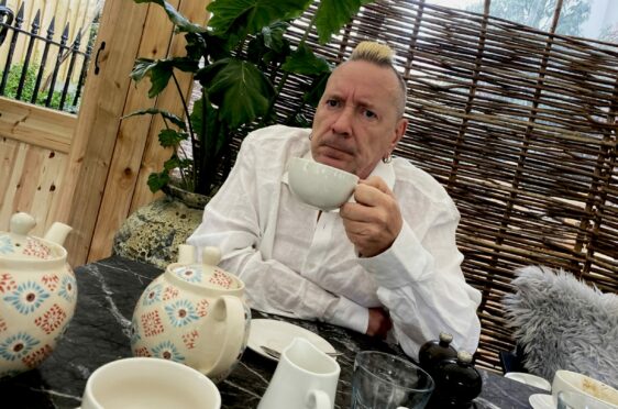 John Lydon sips a cup of tea, in stark contrast to his days as punk hellraiser Johnny Rotten.