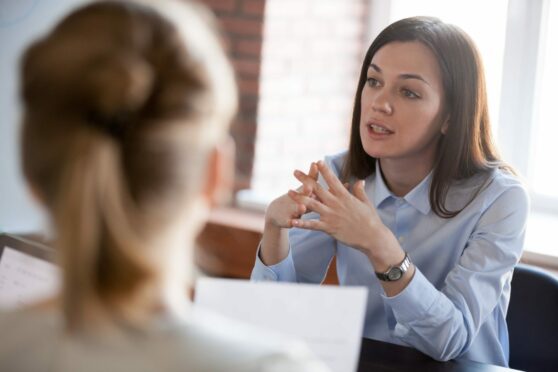 Solicitor in Scotland giving legal advice to clients.