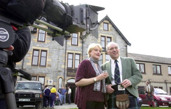 Actors in Tomintoul playing the part of fraudster Tony Williams and his wife Kay for a BBC series in the 2000s.