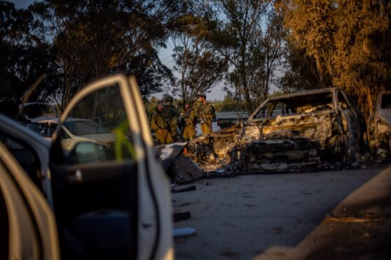 Israeli soldiers check cars left behind after last Saturday’s attack by Hamas on a music festival that killed more than 260 people.