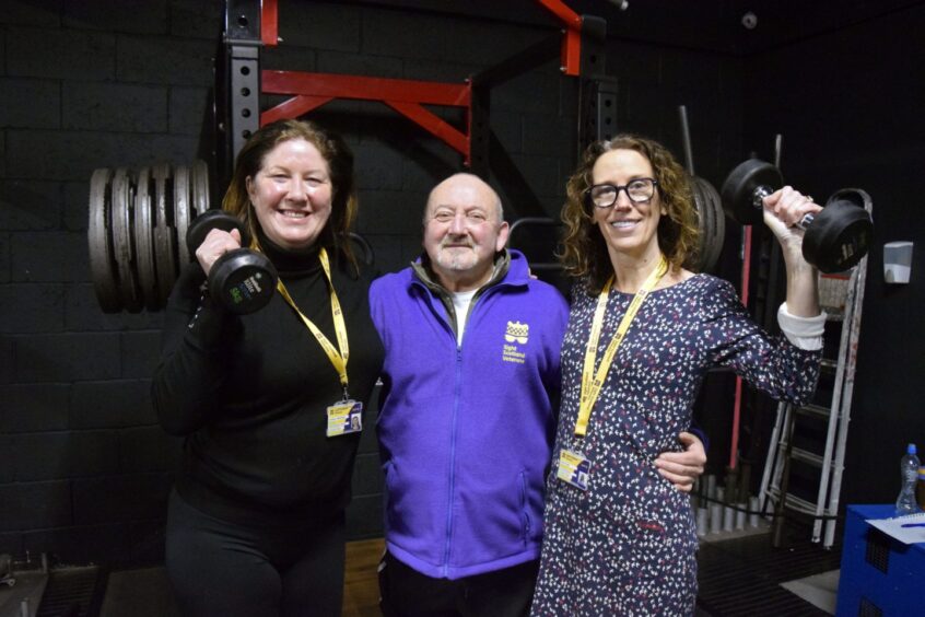 team from Sight Scotland Veterans celebrates army veteran who pursues weight lifting