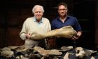 Ben Garrod with Sir David Attenborough in front of bones found as part of documentary Attenborough and the Mammoth Graveyard.