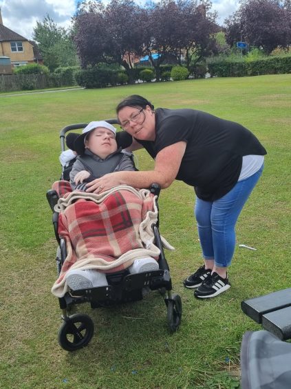 Mum Lizzie and Marley in a local park. Marley died last autumn, several years after a near cot death incident where he was resuscitated but suffered brain damage.
