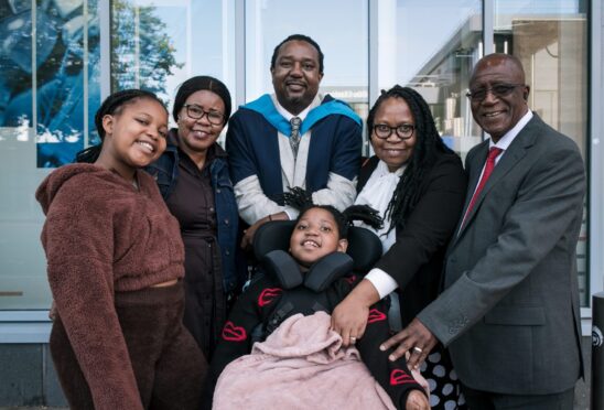 Graduate Vitalis with Cecilia, aunt Pamela, Tawananyasha (in front), wife Lucia and Jailos, his father.