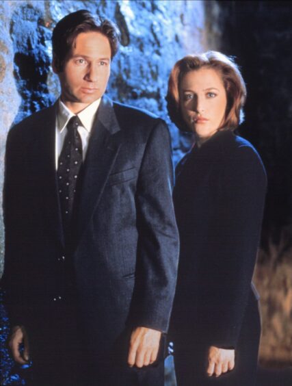 Duchovny and co-star Gillian Anderson as Fox Mulder and Dana Scully in the sci-fi TV hit The X-Files.