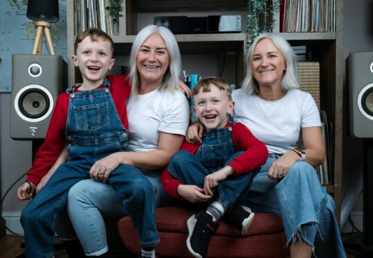 Ali, left, and Marie McLaren had fun growing up and she believes that experience prepared her for her own twins, Jamie, left, and Andy.