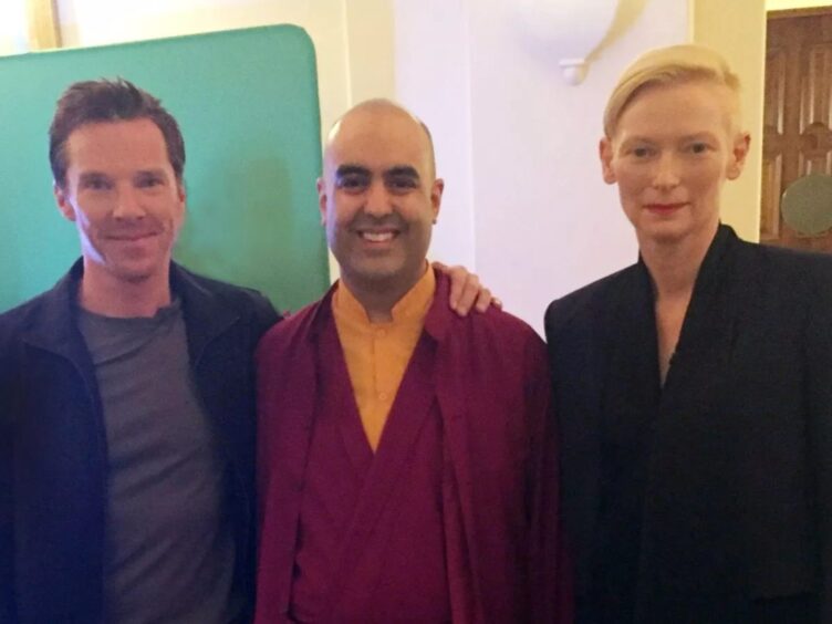 Buddhist monk Gelong Thubten (centre) pictured with Benedict Cumberbatch and Tilda Swinton.