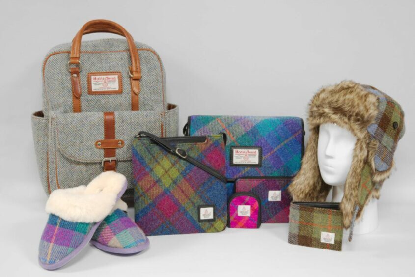 Selection of unique Christmas gift ideas in Scotland from Harris Tweed, including a backpack, purse, slippers and hat.