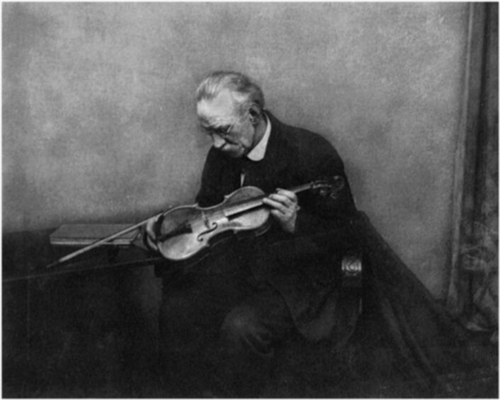 JW Combein named this picture Man With Violin.