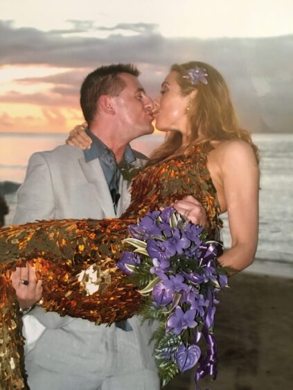 Tina with her husband Geoff on their wedding day in Barbados.
