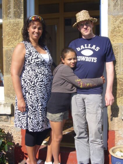 Tamzene with her mum Jermaine and step-dad Campbell. 