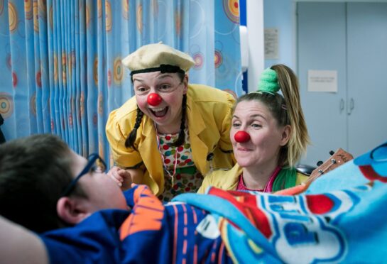 Dr Wallop and Dr Go Go with Mackenzie Cameron at Glasgow Children’s Hospital.