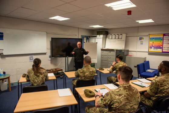 Alan Laidlaw from The College Partnership teaching soldier school students from 2 SCOTS