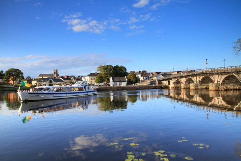 A scenic image of the River Shannon in Ireland. It is a bright sunny day.