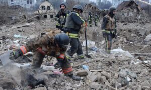 Ukrainian firefighters search for a little girl and her father in the ruins of their home following a Russian missile attack in Zaporizhzhia.
