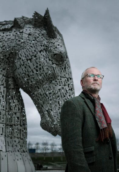Sculptor Andy Scott with one of his Kelpies.