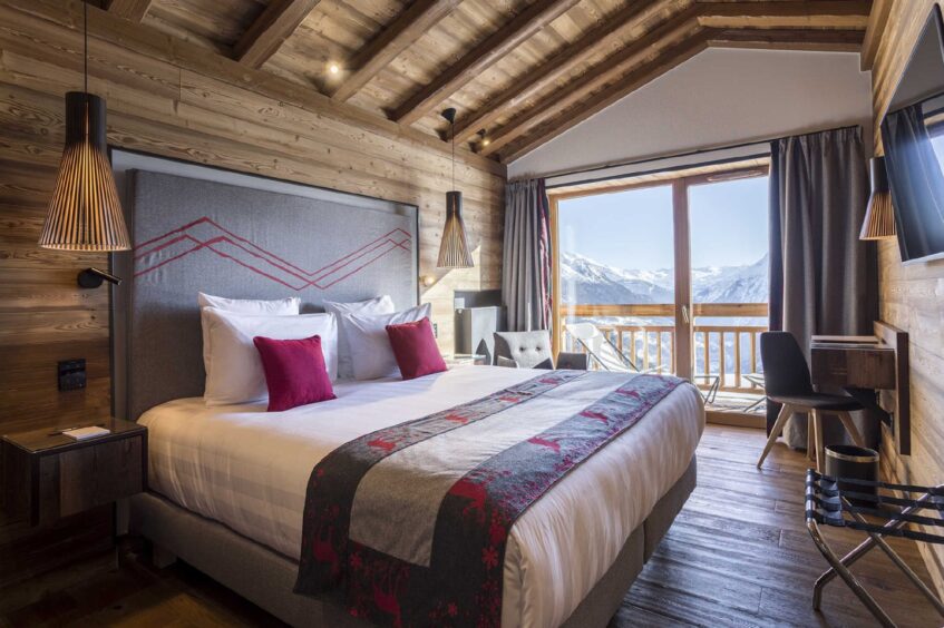 Plush rooms at Hotel Alparena with stunning mountain views.