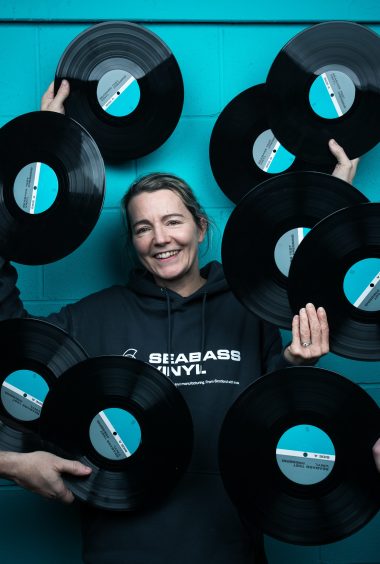 Dominique Harvey, co-owner of Seabass Vinyl, with the company’s new records, made from recycled cooking oil – and with a carbon footprint 90% less than PVC.