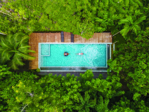 Aerial drone view of swimming pool at a villa