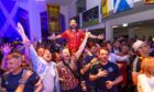 Show Bavaria how Scots party? It’s all in the Line Of Duty for actor Martin Compston as he leads the singing at the Isarpost building in Munich on the eve of the opening game.