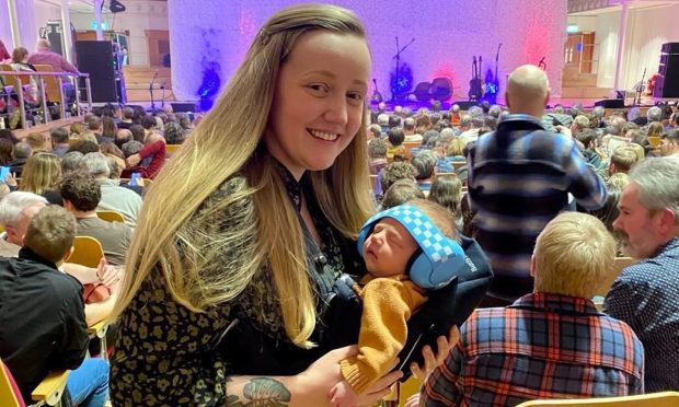 Marianne Fraser with her son Soren at the gig that inspired her to return to music.