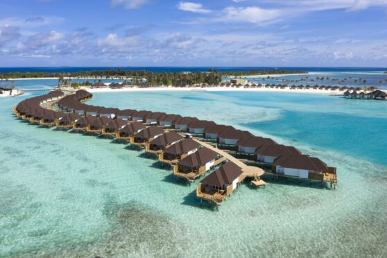 Luxury huts over the water at Sun Siyam Olhuveli beach resort.