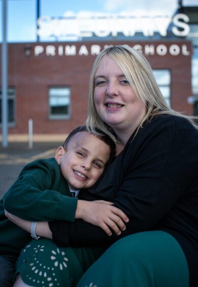 Caleb with his mother, Karen.