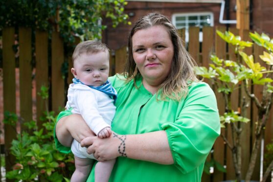 Carrie O’Donnell with her baby son Oliver at home in Paisley