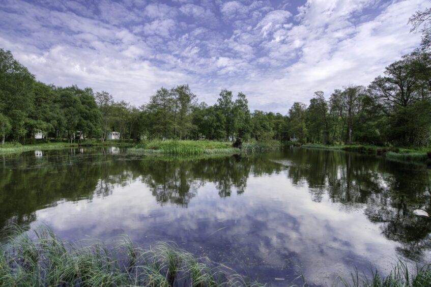 man-made loch in Glenesk Holiday Park, site of holiday homes in Aberdeenshire